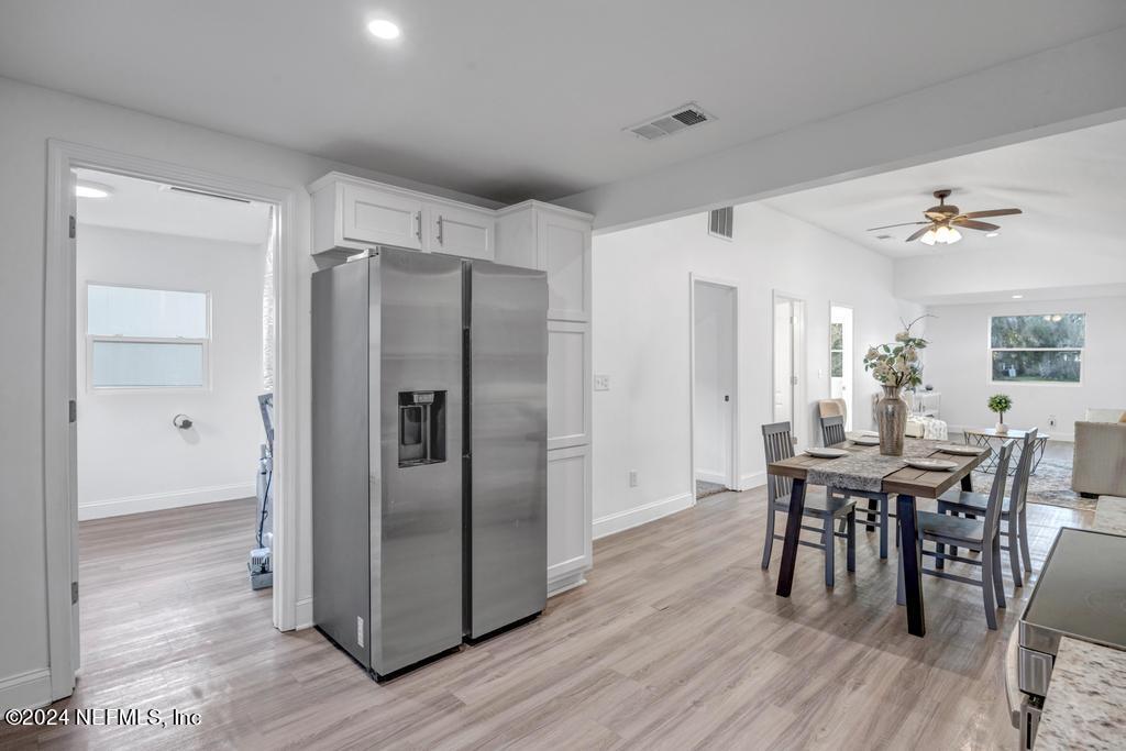 4623 Ribault Park Street Jacksonville, FL 32233 - Photo 16 of 30 a view of a dining room with furniture window and wooden floor