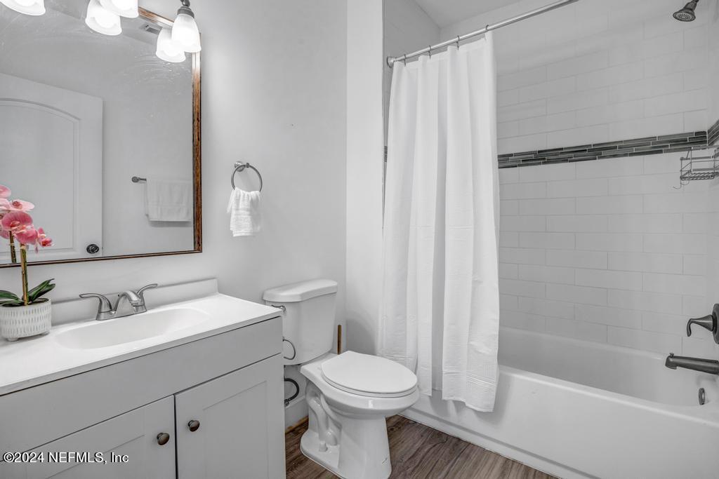 4623 Ribault Park Street Jacksonville, FL 32233 - Photo 20 of 30 a bathroom with a sink toilet and shower