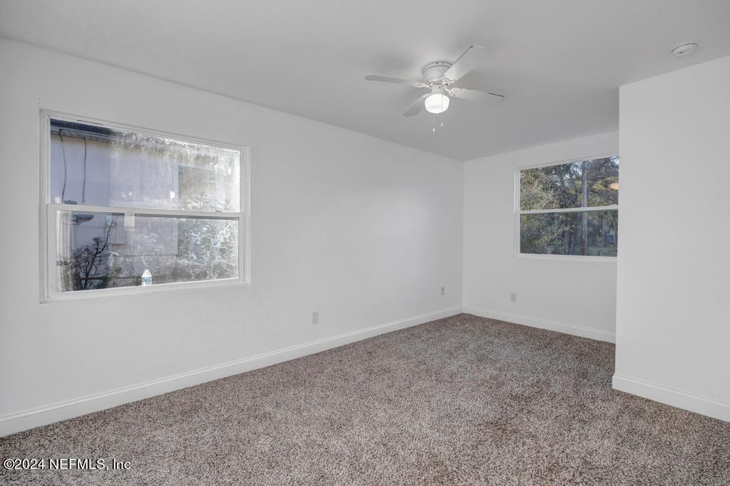 4623 Ribault Park Street Jacksonville, FL 32233 - Photo 21 of 30 an empty room with a window
