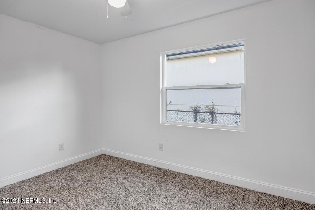 4623 Ribault Park Street Jacksonville, FL 32233 - Photo 24 of 30 an empty room with a window