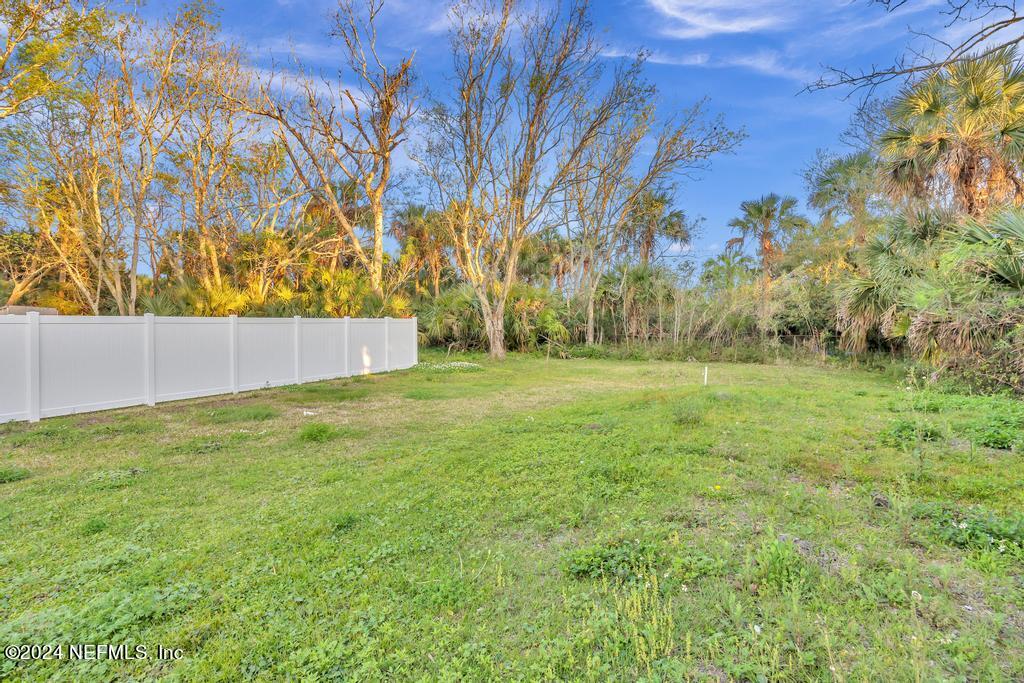 4623 Ribault Park Street Jacksonville, FL 32233 - Photo 30 of 30 a view of outdoor space with trees all around