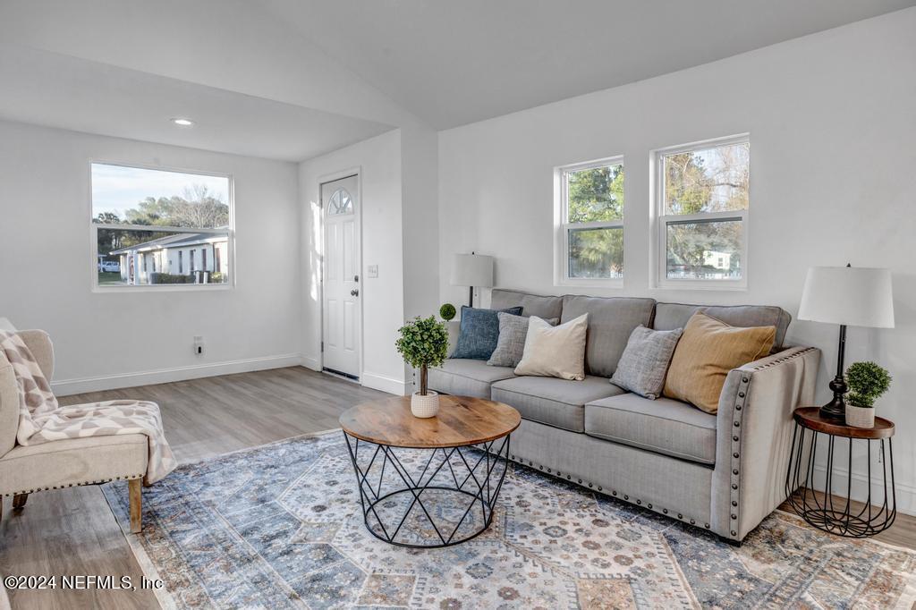4623 Ribault Park Street Jacksonville, FL 32233 - Photo 7 of 30 a living room with furniture and a window
