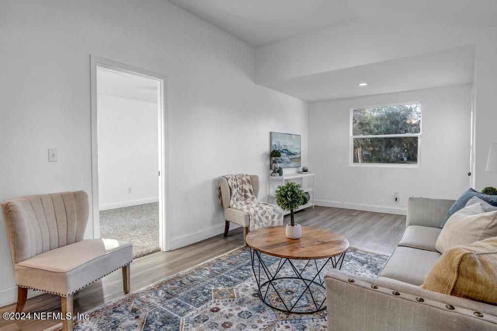 4623 Ribault Park Street Jacksonville, FL 32233 - Photo 9 of 30 a living room with furniture and a potted plant