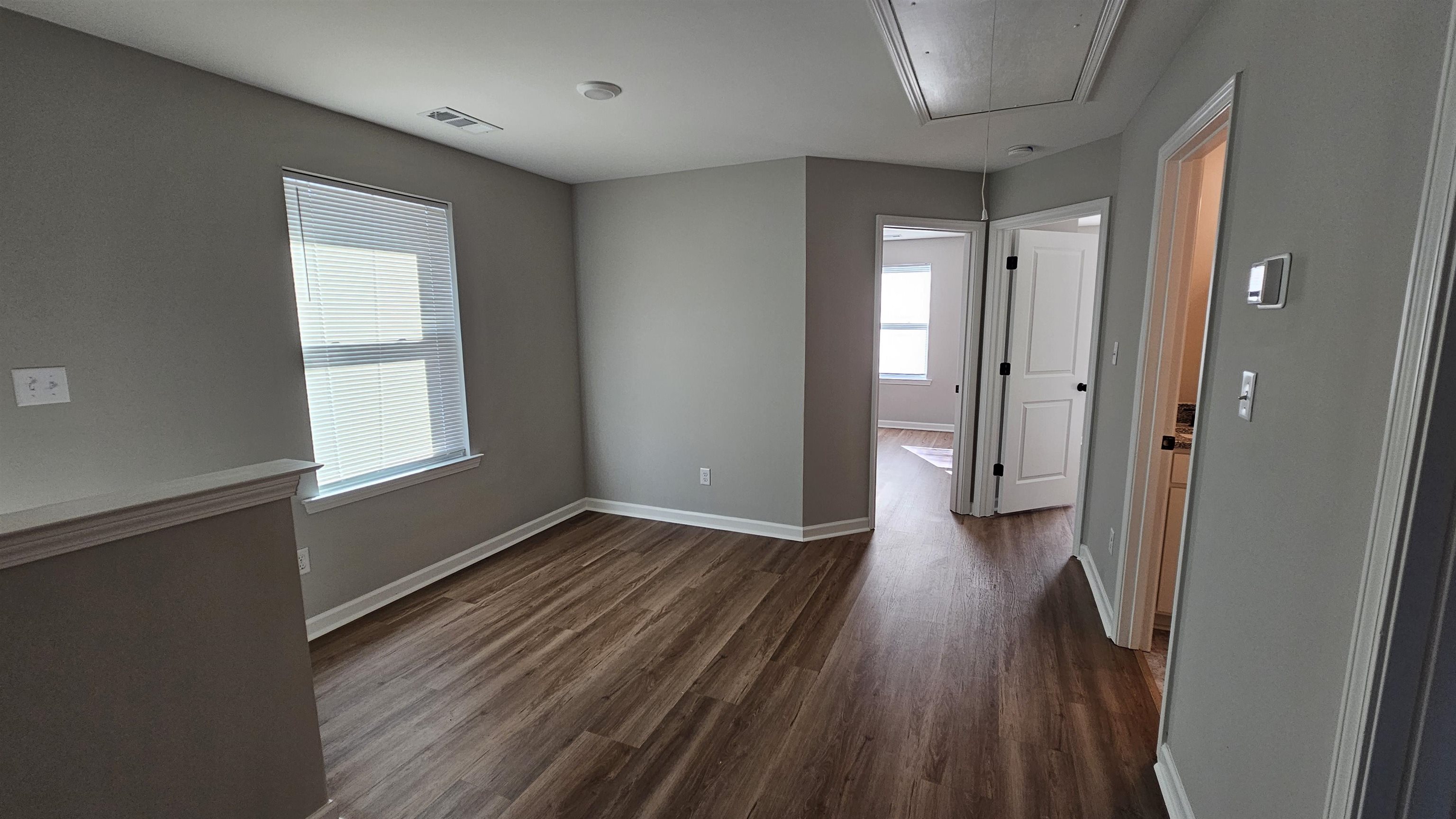 2234 East Alcy Road Memphis, TN 38114 - Photo 14 of 23 a view of a hallway with wooden floor and a window