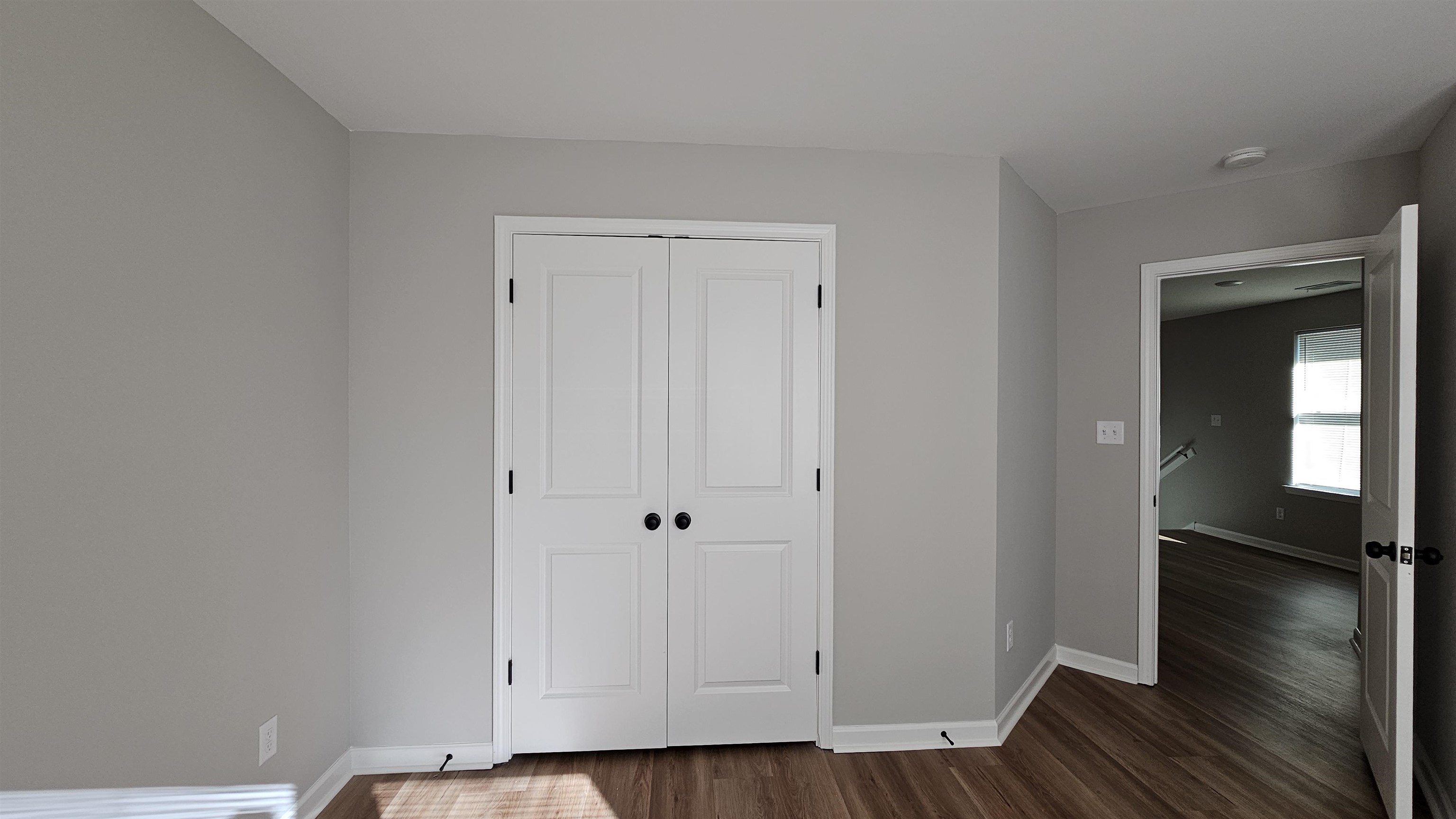 2234 East Alcy Road Memphis, TN 38114 - Photo 15 of 23 a view of an empty room with wooden floor