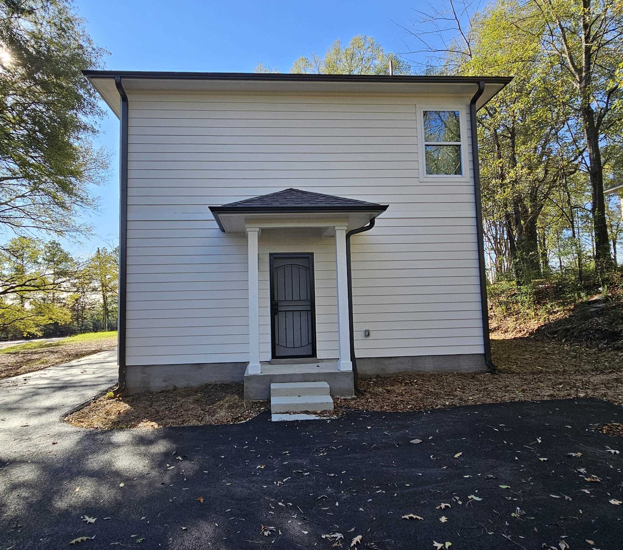 2234 East Alcy Road Memphis, TN 38114 - Photo 22 of 23 a front view of a house with a yard