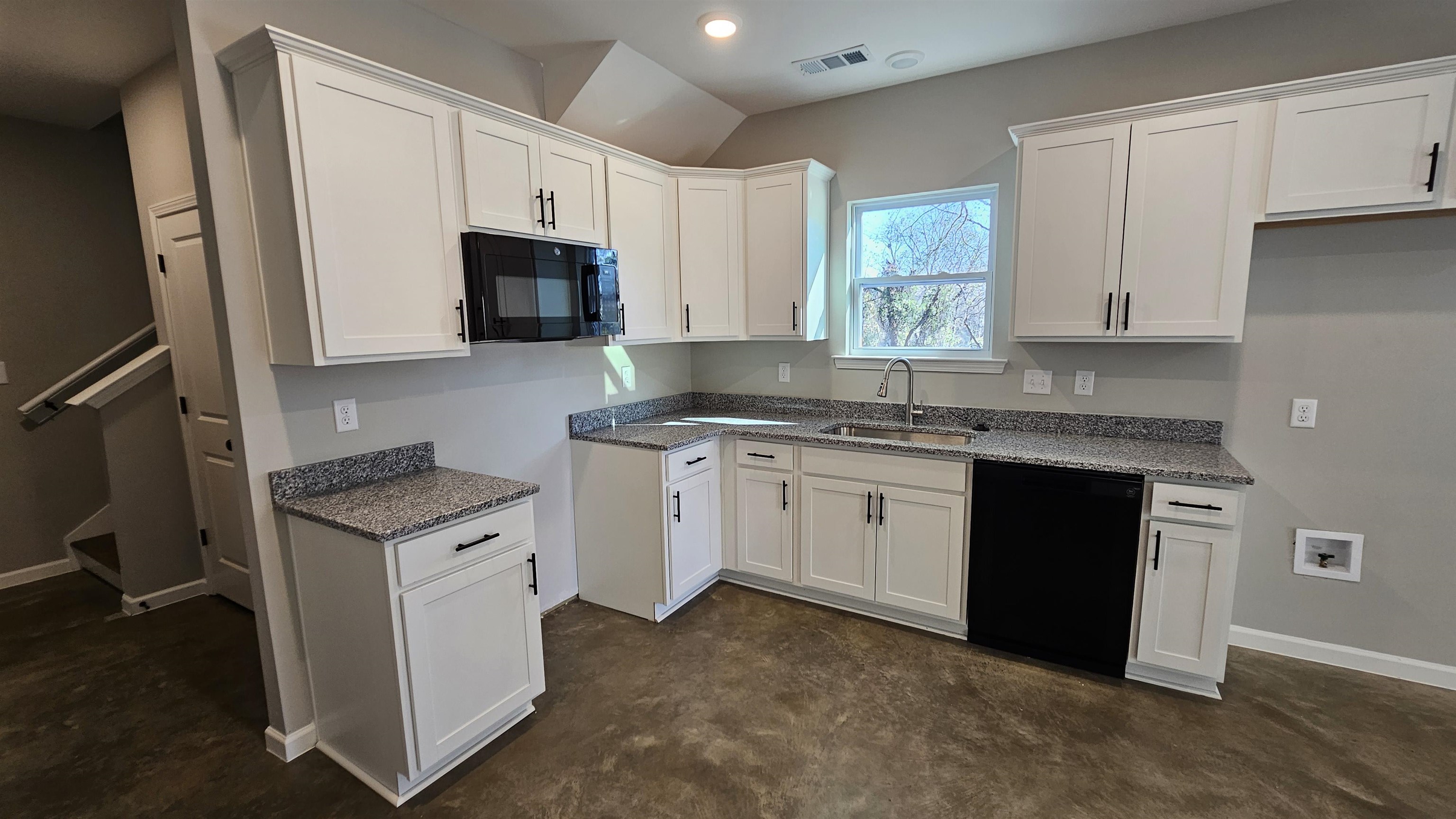 2234 East Alcy Road Memphis, TN 38114 - Photo 7 of 23 a kitchen with granite countertop a sink stove and refrigerator