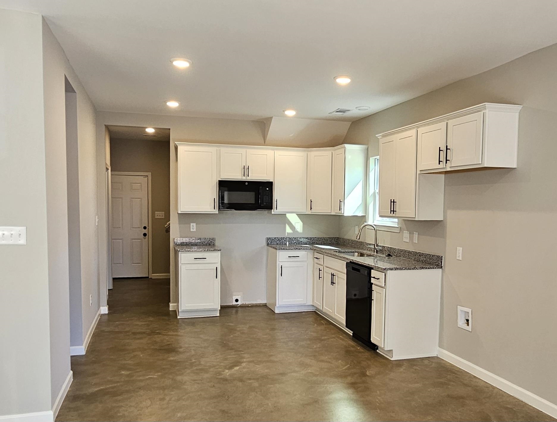 2234 East Alcy Road Memphis, TN 38114 - Photo 8 of 23 a kitchen with white cabinets and appliances