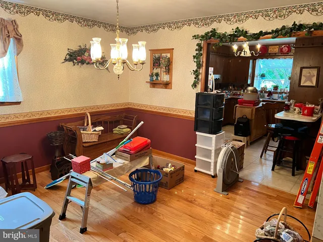 a room with furniture a rug and a chandelier