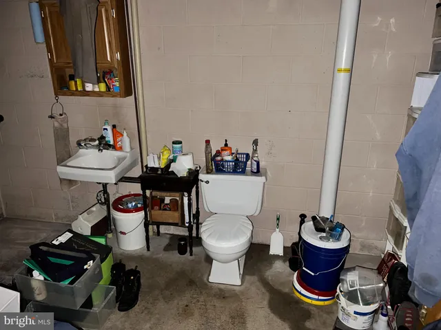 a bathroom with a toilet and a sink