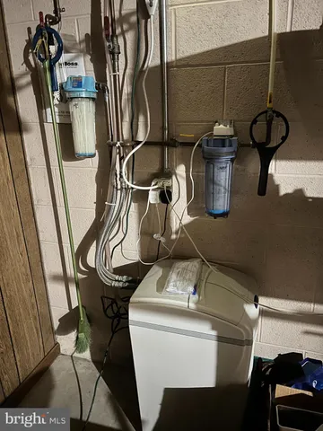 a kitchen with a sink appliances and cabinets