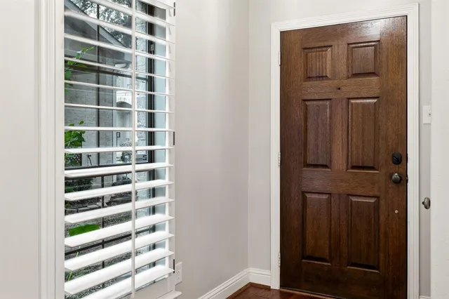 a open kitchen with white cabinets and stainless steel appliances