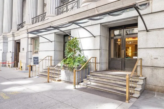 a house with potted plants in front of it