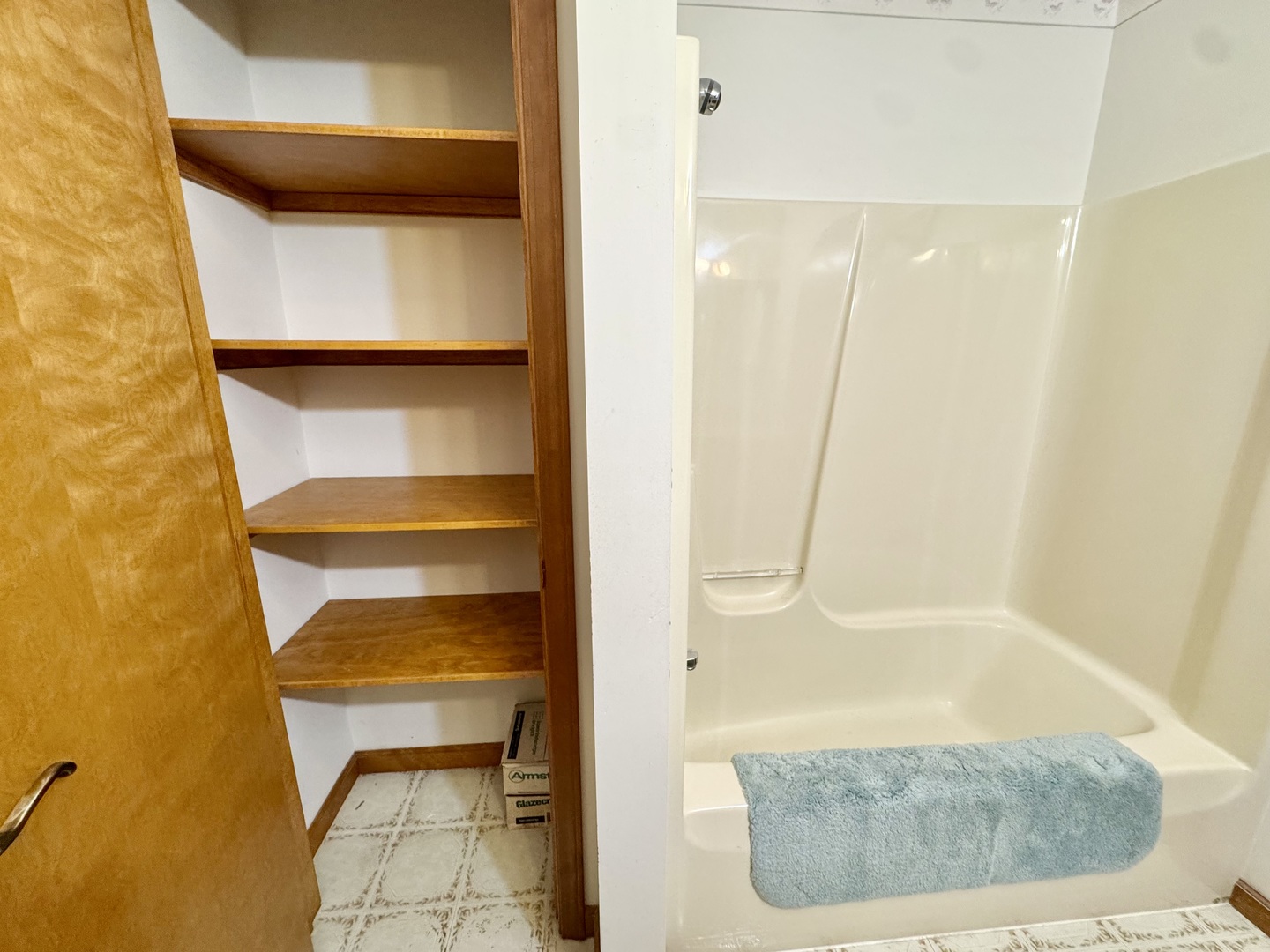31 Colonial Drive Clinton, IL 61727 - Photo 15 of 24 a bathroom with a tub and shower