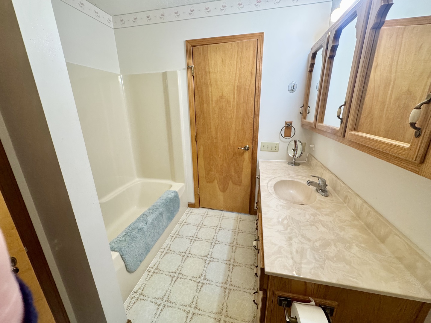 31 Colonial Drive Clinton, IL 61727 - Photo 16 of 24 a bathroom with a granite countertop sink and a mirror