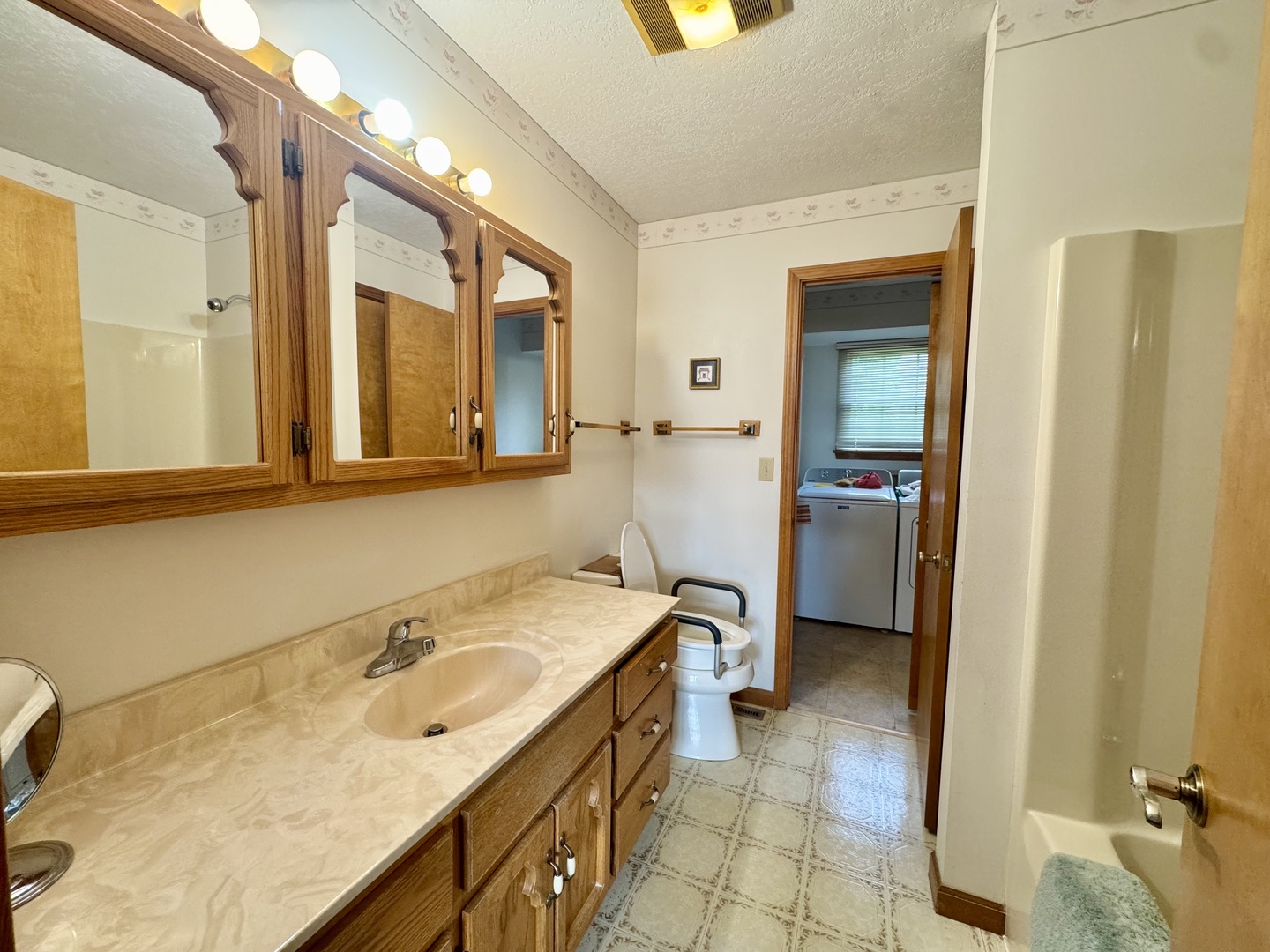 31 Colonial Drive Clinton, IL 61727 - Photo 18 of 24 a bathroom with a sink and a mirror