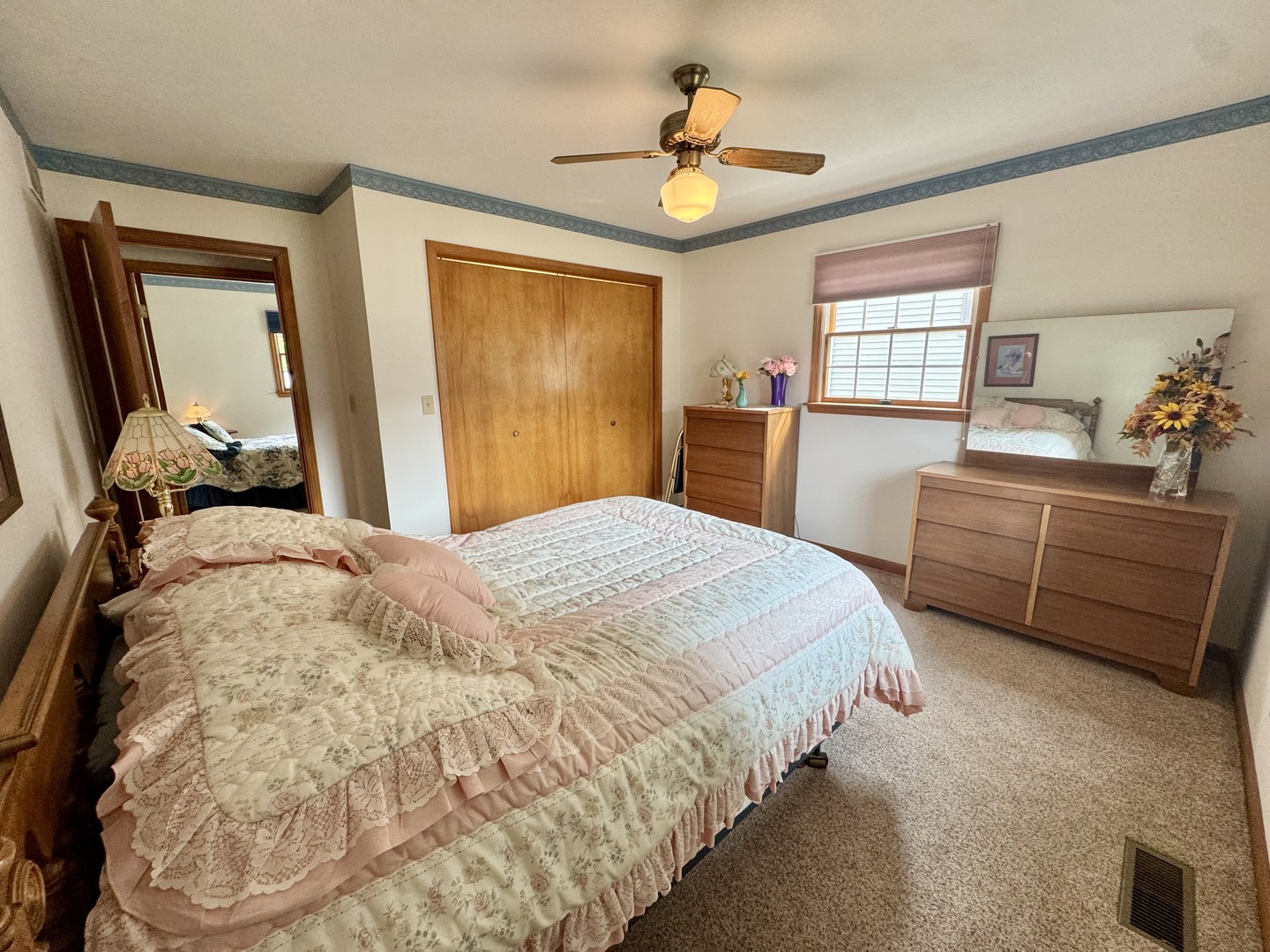 31 Colonial Drive Clinton, IL 61727 - Photo 21 of 24 a bedroom with a bed a dresser and window