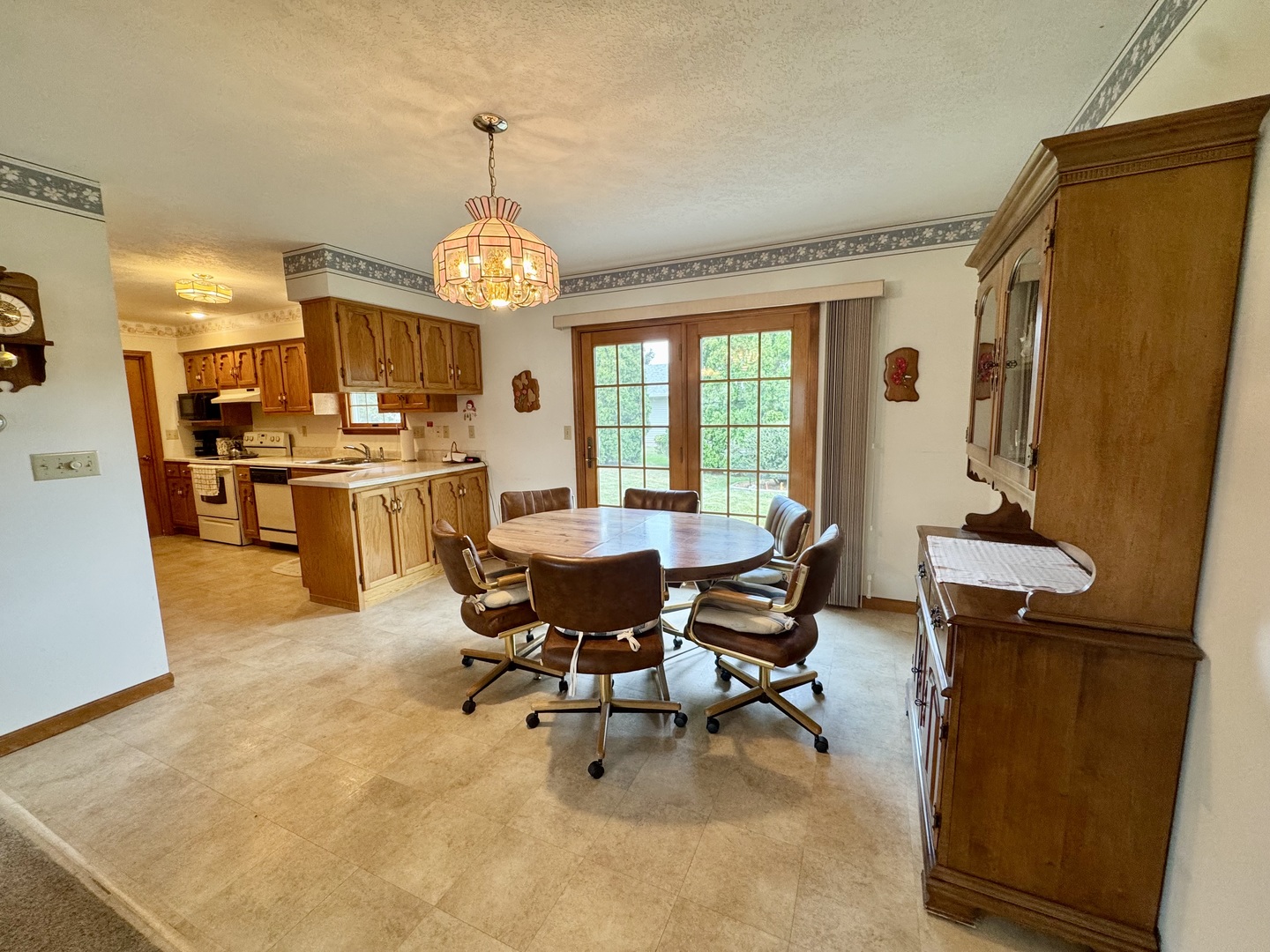 31 Colonial Drive Clinton, IL 61727 - Photo 8 of 24 a view of a dining room with furniture and chandelier