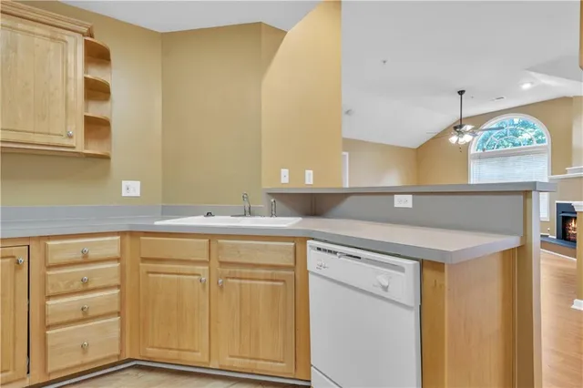 a view of a kitchen counter space and windows