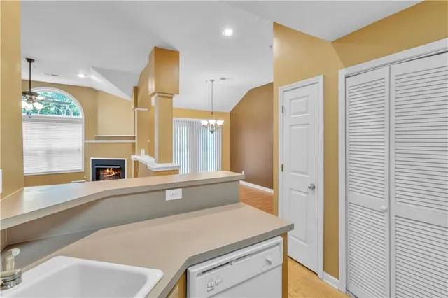 a view of a kitchen cabinets and a window