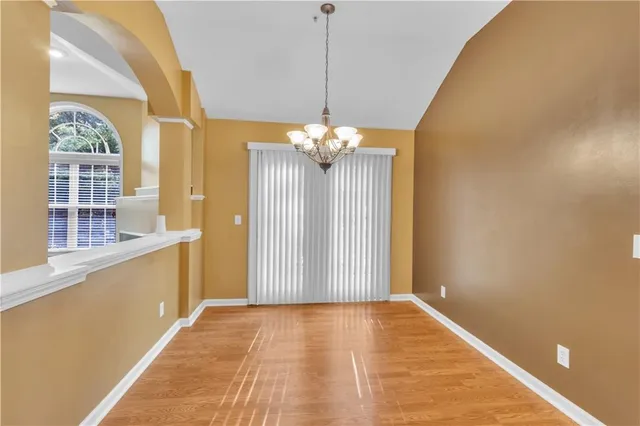 a view of a bathroom with a tub and painted walls