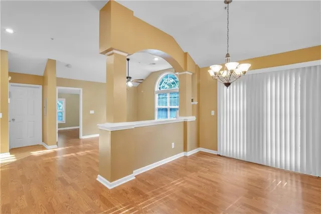 a view of a hallway with a chandelier