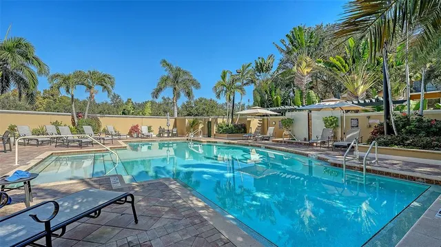 a view of swimming pool with chairs