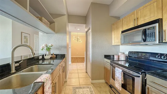 a kitchen with a stove and a sink