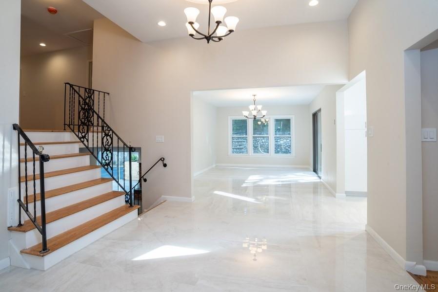 17 Vista Drive Great Neck, NY 11021 - Photo 1 of 20 Entrance foyer featuring a chandelier, recessed lighting, and stairs