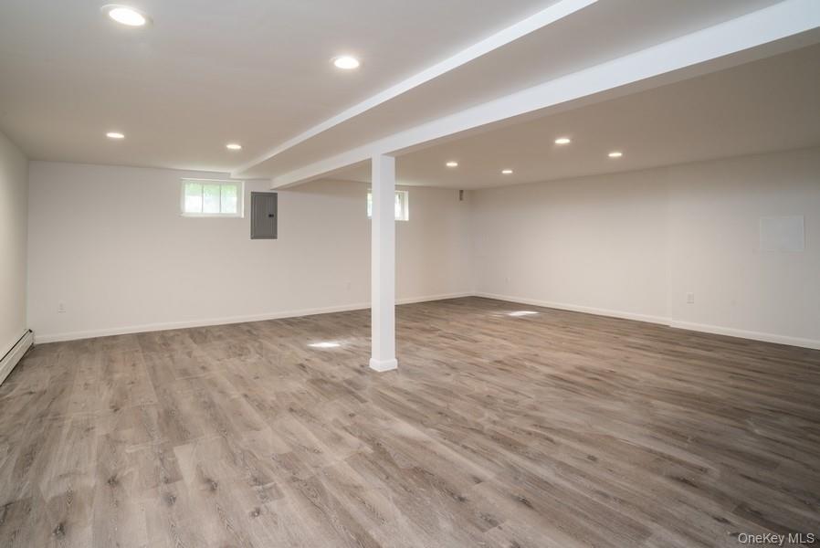 17 Vista Drive Great Neck, NY 11021 - Photo 17 of 20 Below grade area with electric panel, recessed lighting, and wood finished floors