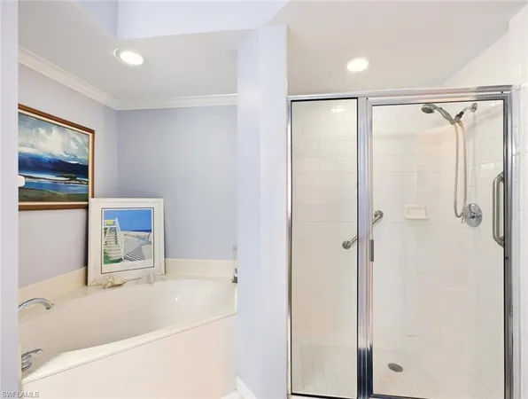 a bathroom with a bathtub and a shower