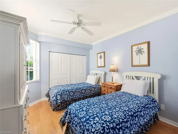 a bedroom with bed and window