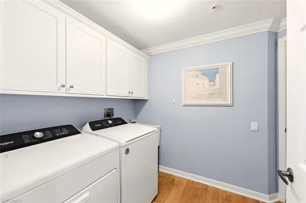 a view of storage and utility room with washer and dryer