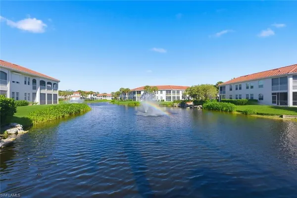 a view of a lake with a yard