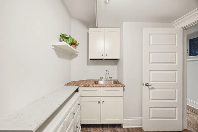 a bathroom with a sink and cabinets