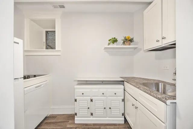 a view of cabinets and window