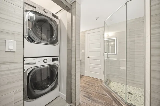 a view of a hallway with washer and dryer