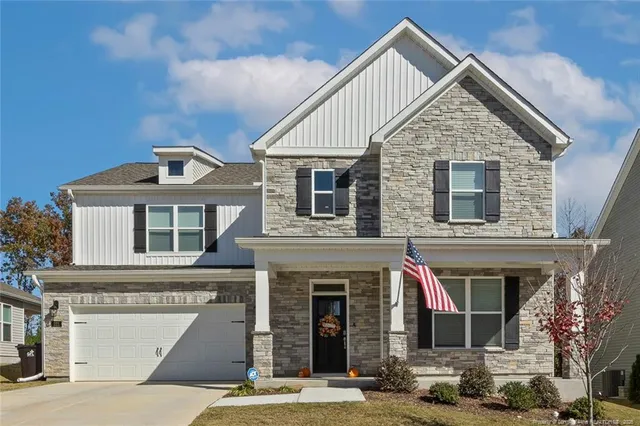 a front view of a house with yard