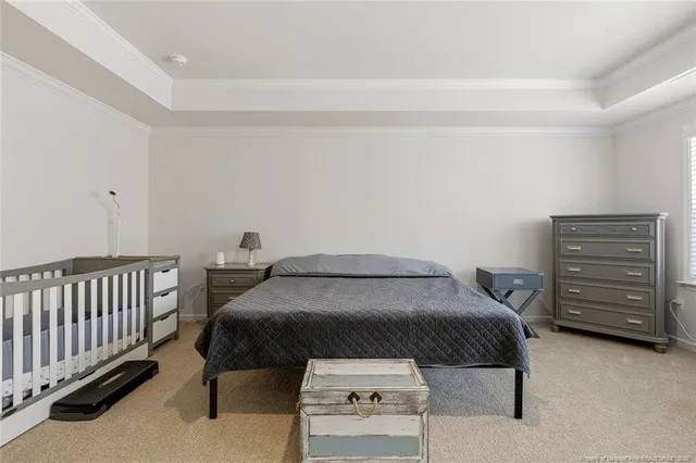 a bedroom with a bed and a cabinets