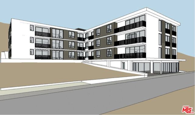 a aerial view of a house with a yard patio and garage