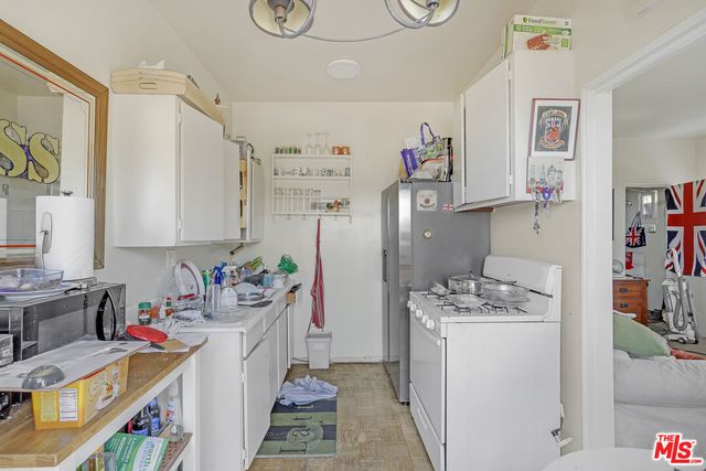 a front view of a house with a plants