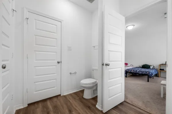 a view of a bathroom with a toilet and a shower