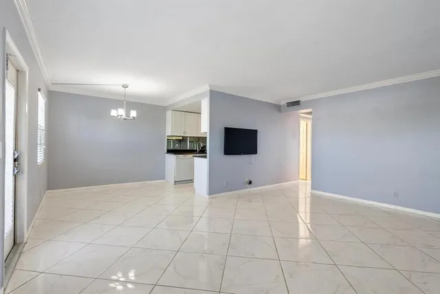 a view of a kitchen with a refrigerator and a stove