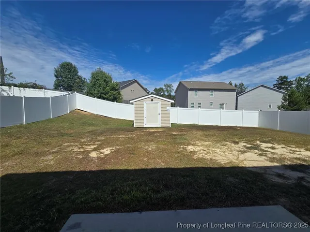 a view of a pool with an outdoor space