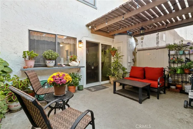 a view of outdoor seating area with furniture and garden view