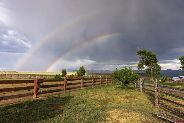 a backyard of a house with lots of green space