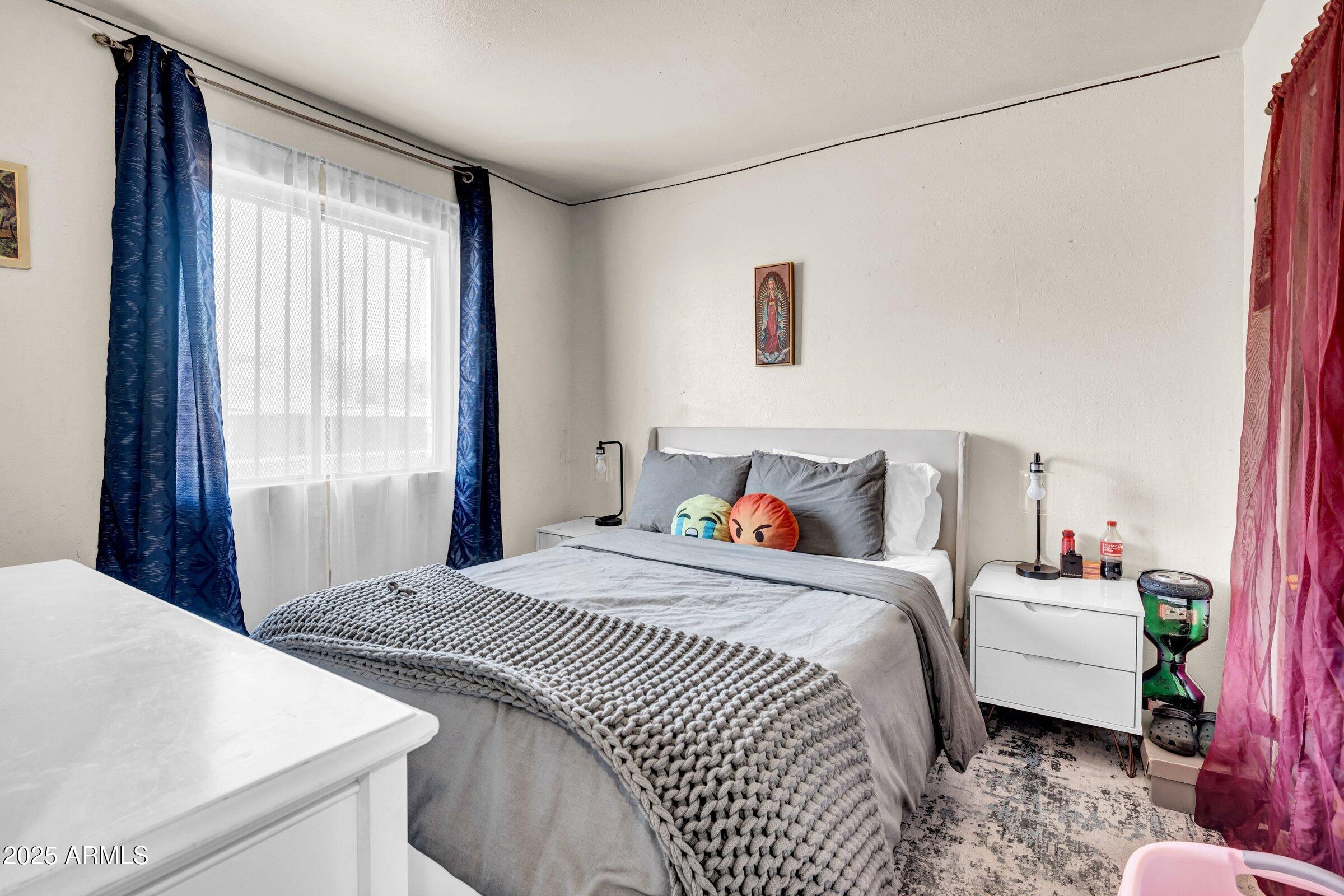 1123 West Fillmore Street Phoenix, AZ 85007 - Photo 17 of 20 a bedroom with a bed and a window