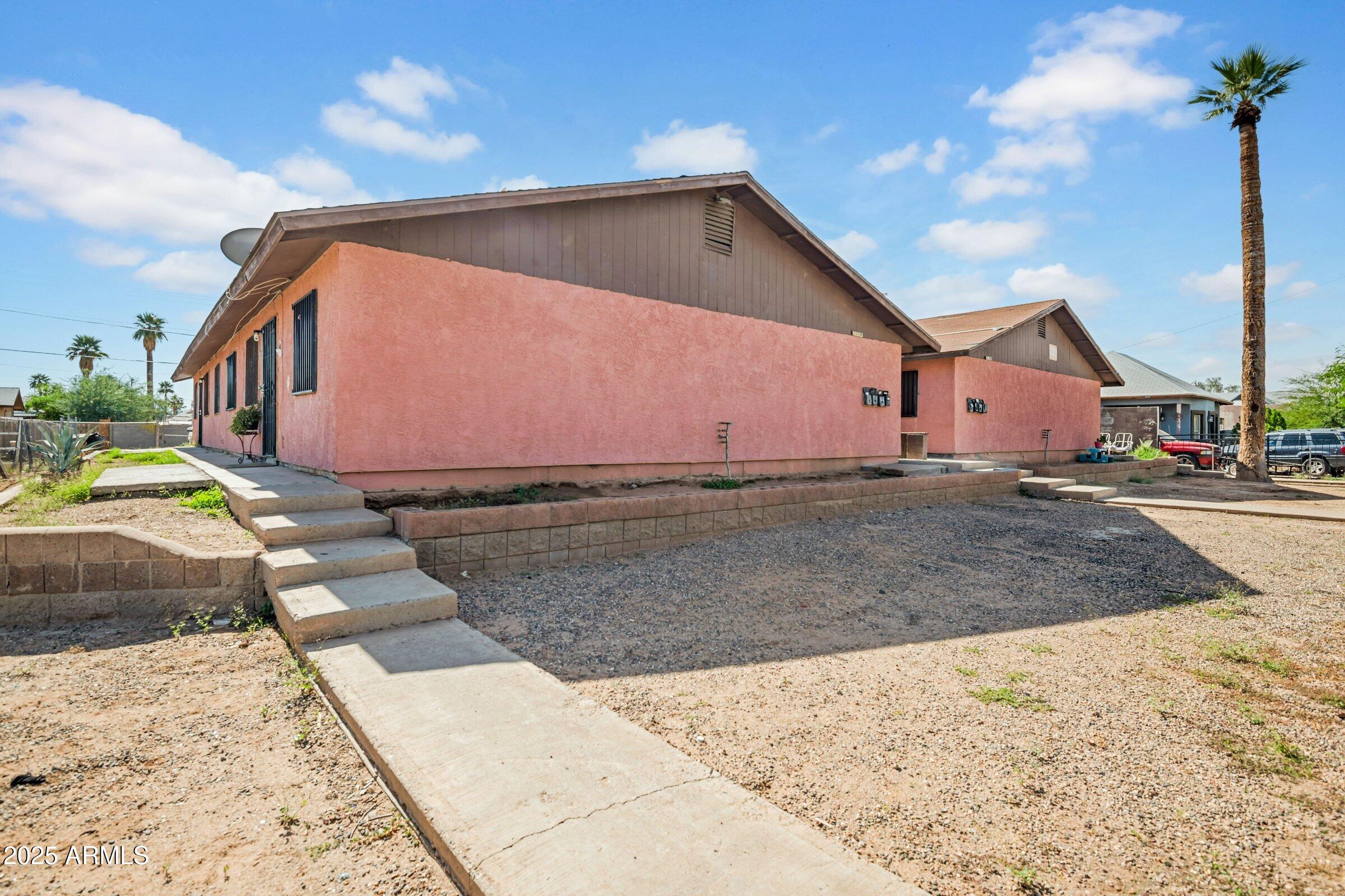 1123 West Fillmore Street Phoenix, AZ 85007 - Photo 2 of 20 a front view of a house with a yard