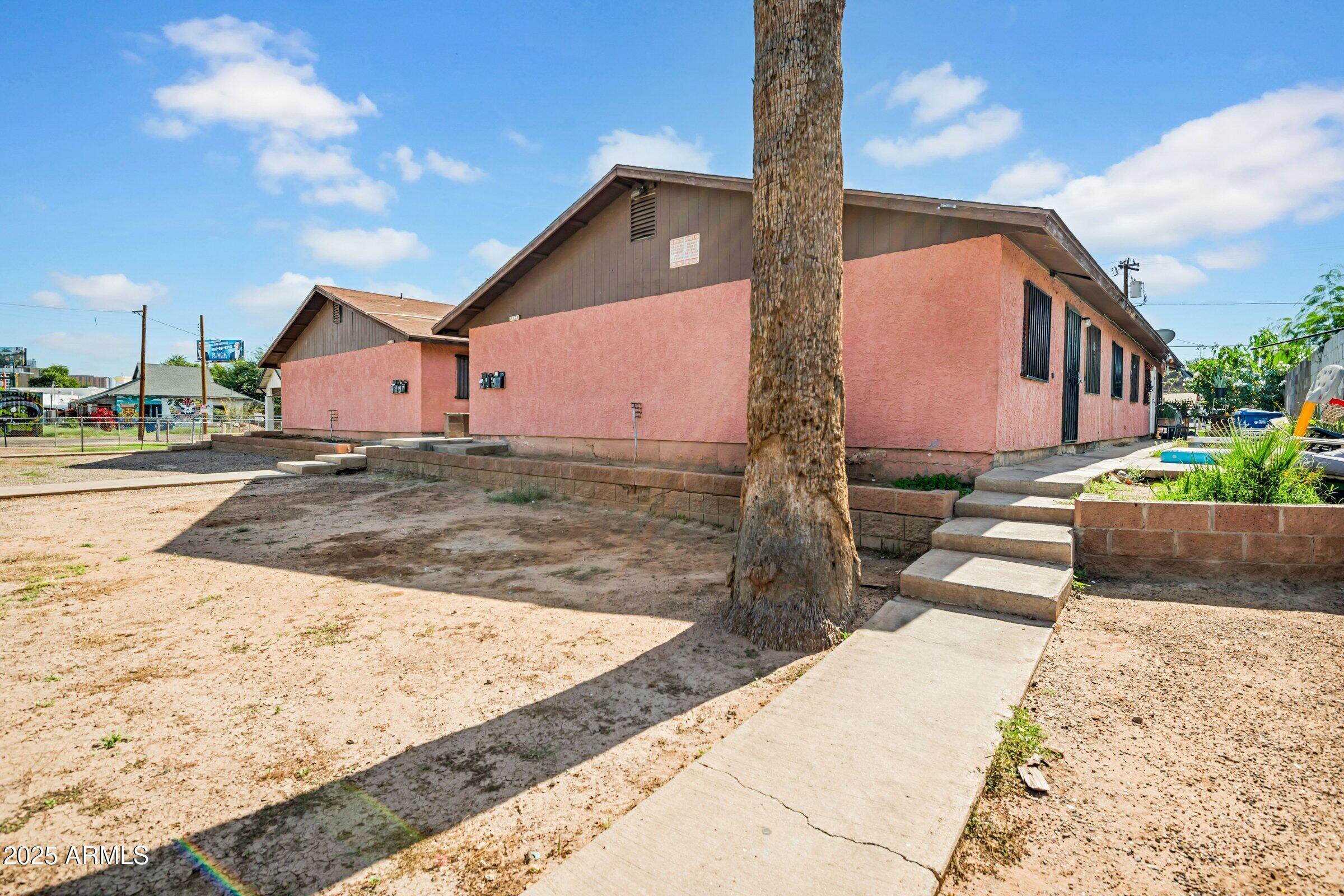 1123 West Fillmore Street Phoenix, AZ 85007 - Photo 3 of 20 a front view of a house with a yard
