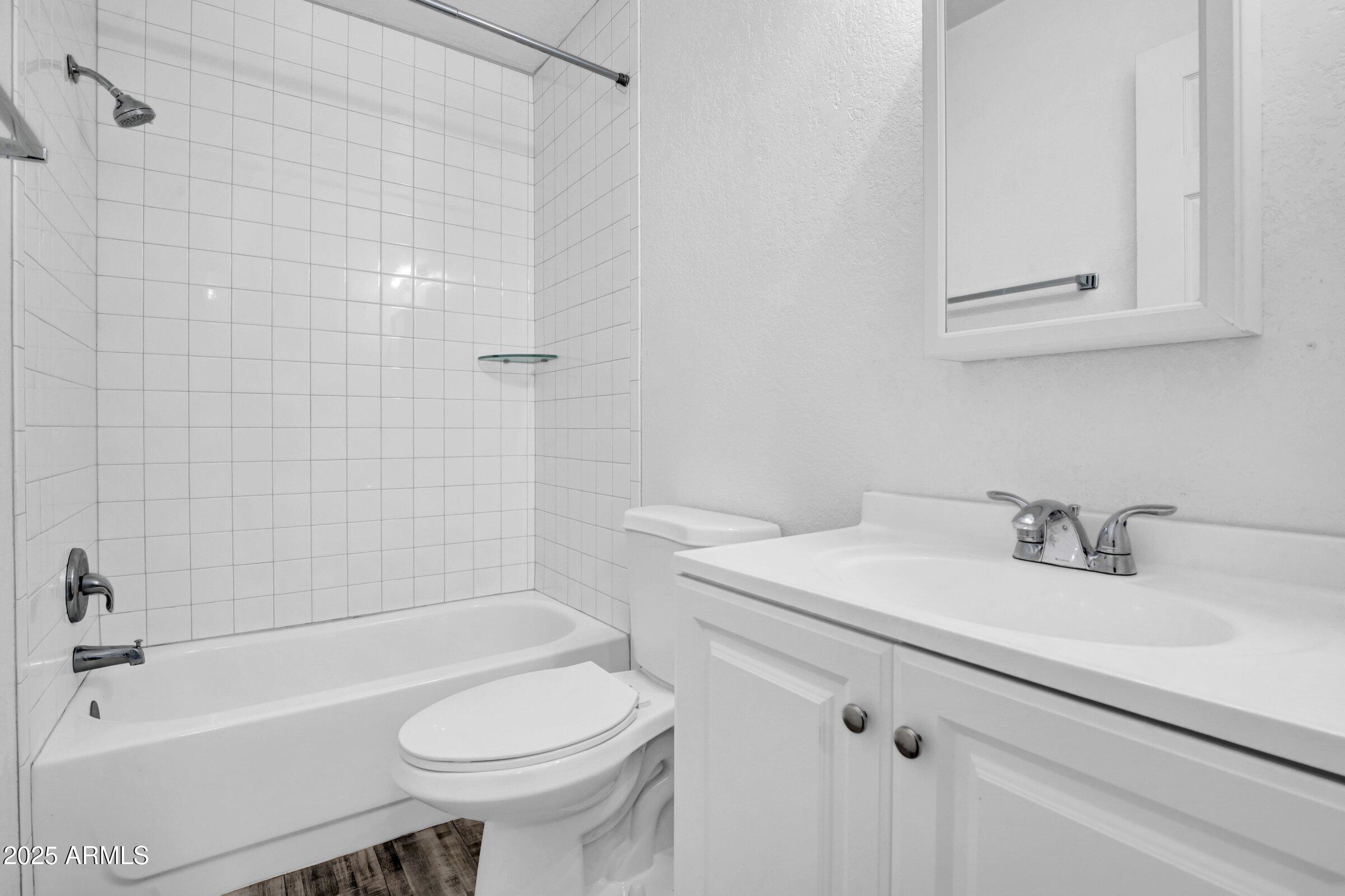 1123 West Fillmore Street Phoenix, AZ 85007 - Photo 10 of 20 a bathroom with a sink toilet and shower
